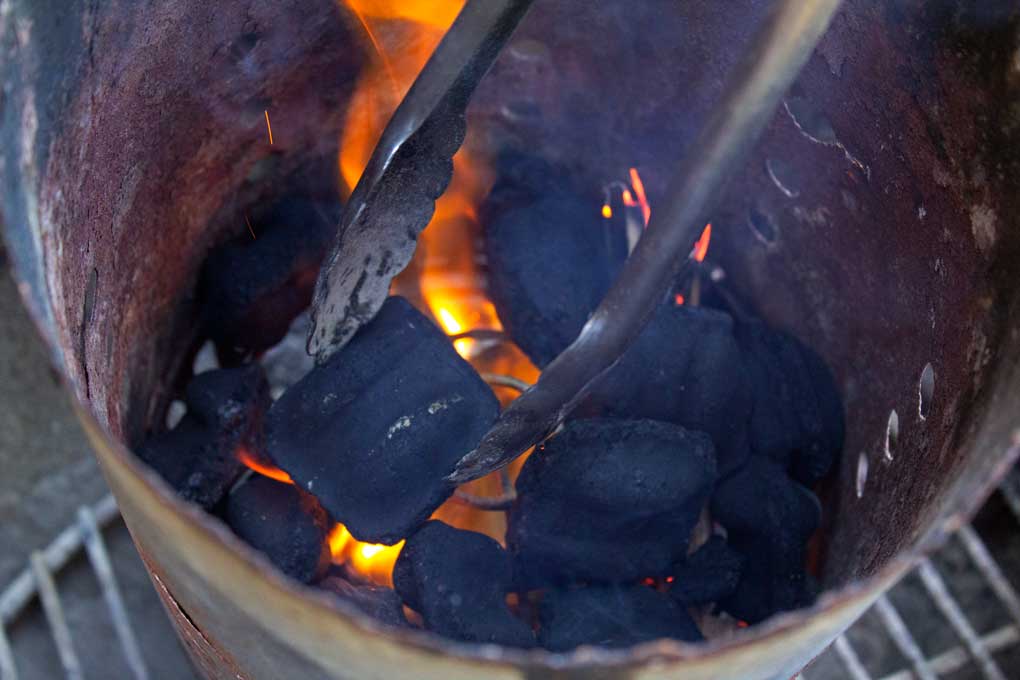 coals inside charcoal chimney