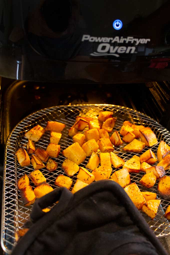 removing air-fried butternut squash from air fryer