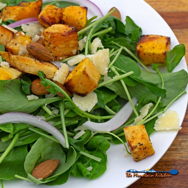 butternut squash arugula salad on plate