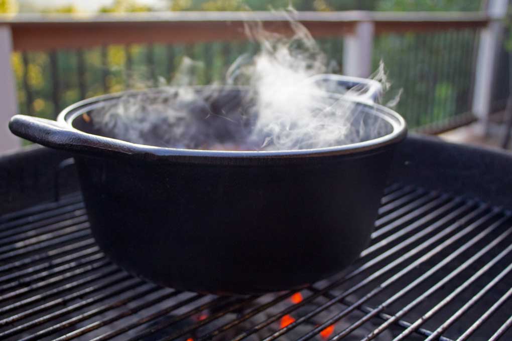 steaming Dutch oven on grill