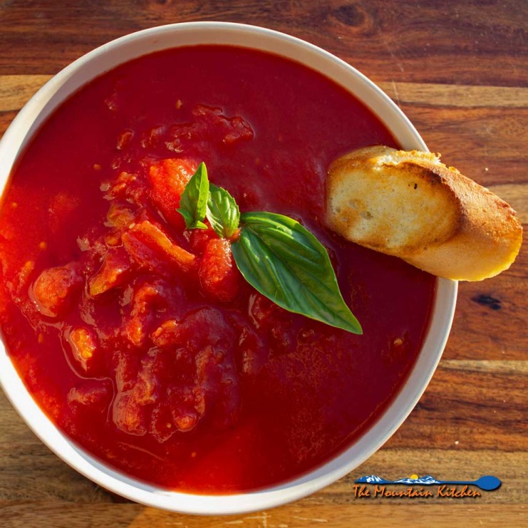 bowl of grilled tomato soup with grilled toast
