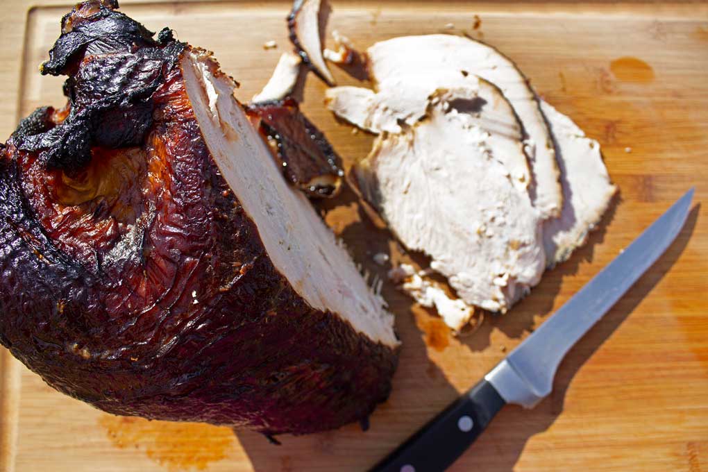 brined hickory-smoked turkey breast sliced on cutting board