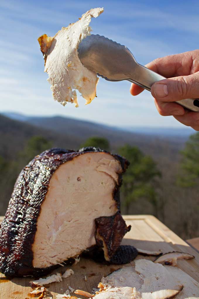 brined hickory-smoked turkey breast sliced with mountain view