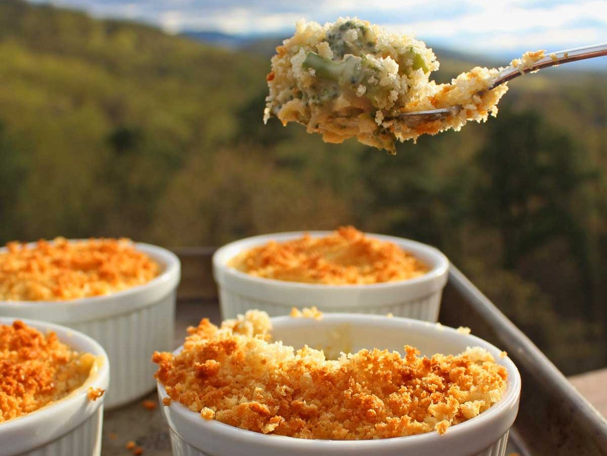 Mini cheesy broccoli casseroles are a versatile side dish, filled with tender broccoli, a made from scratch cheese sauce, topped with crunchy bread crumbs.