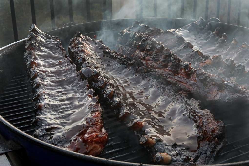 saucy baby back ribs on grill