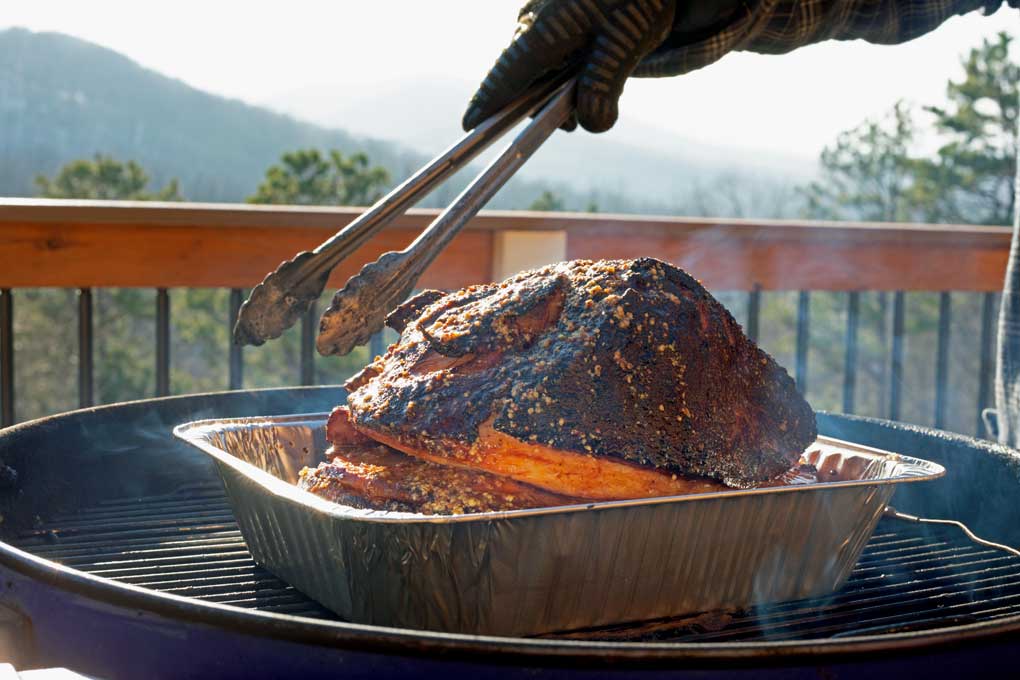 double smoked ham in pan on grill