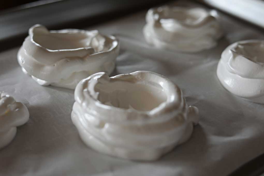 piped meringue  on baking sheet