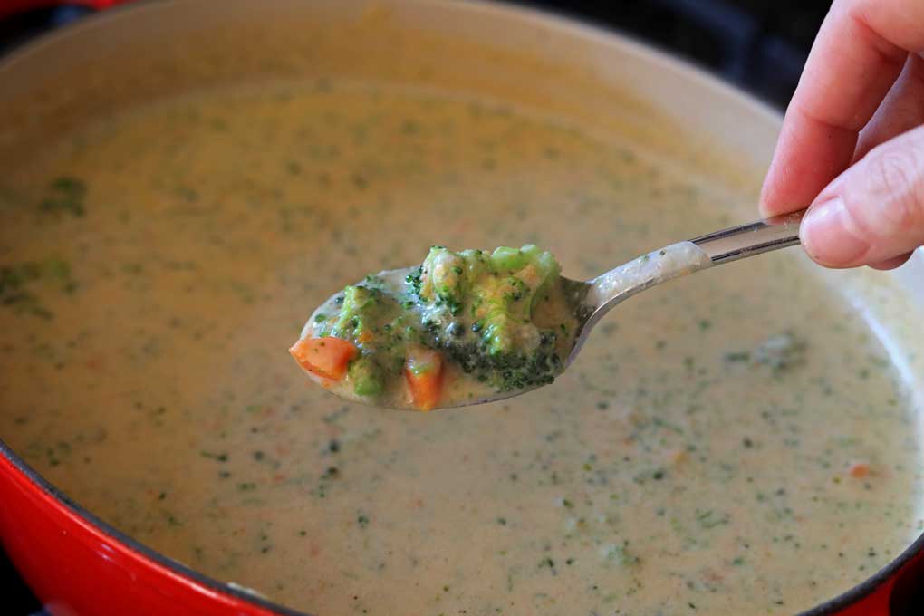 spoonful of soup from pot