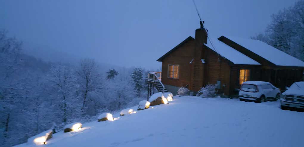our home in evening snow