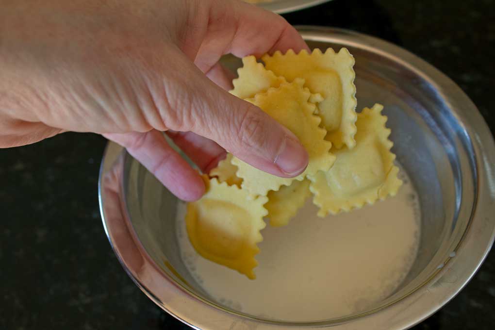 dipping ravioli into buttermilk