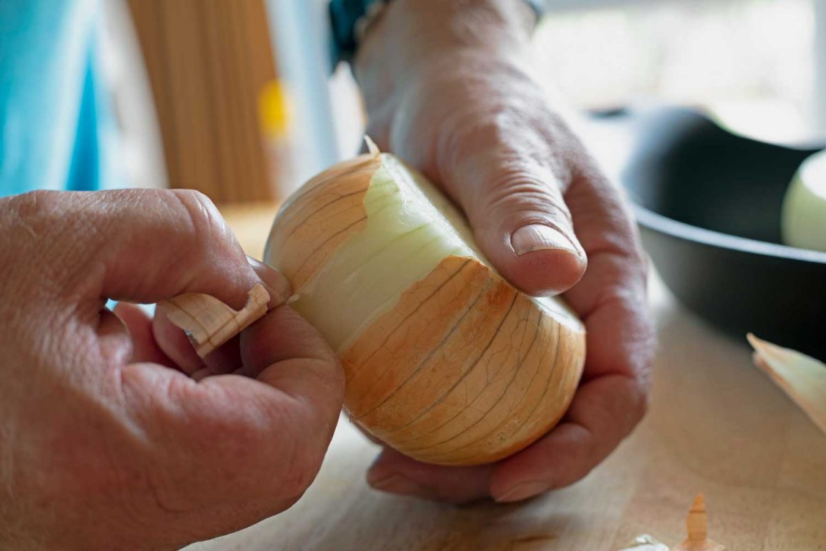 peeling the skin off onion