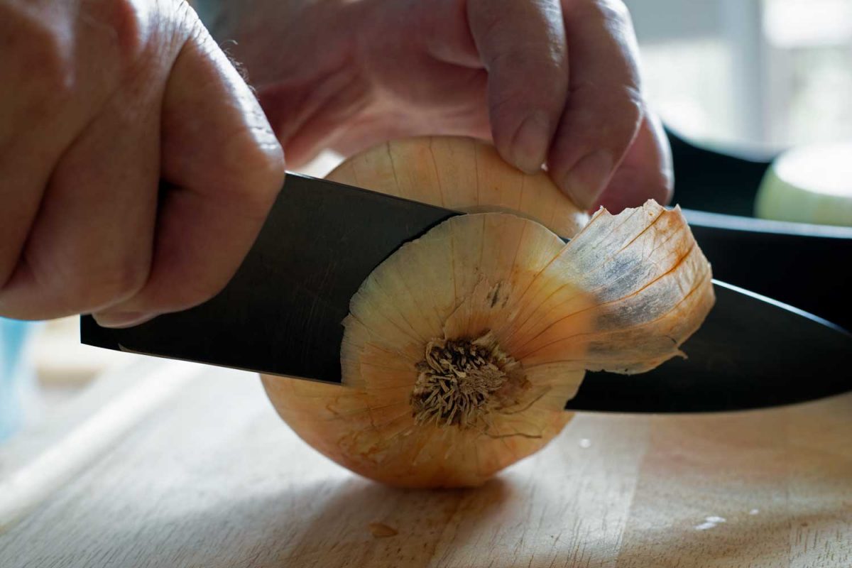 cutting root off onion