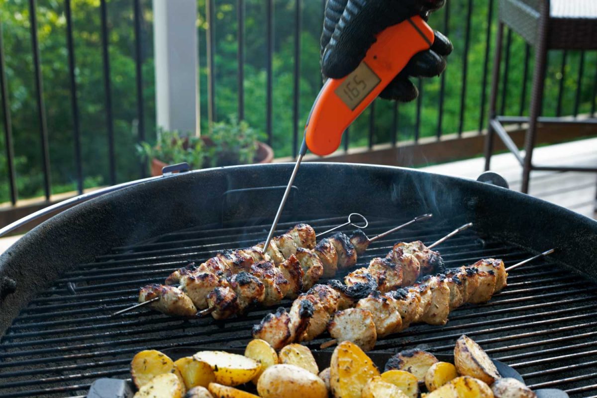 checking chicken kabobs with Thermapen instant-read thermometer