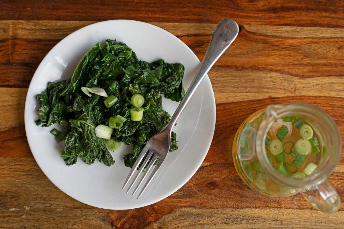 plate of sauteed kale and spring onion vinegar