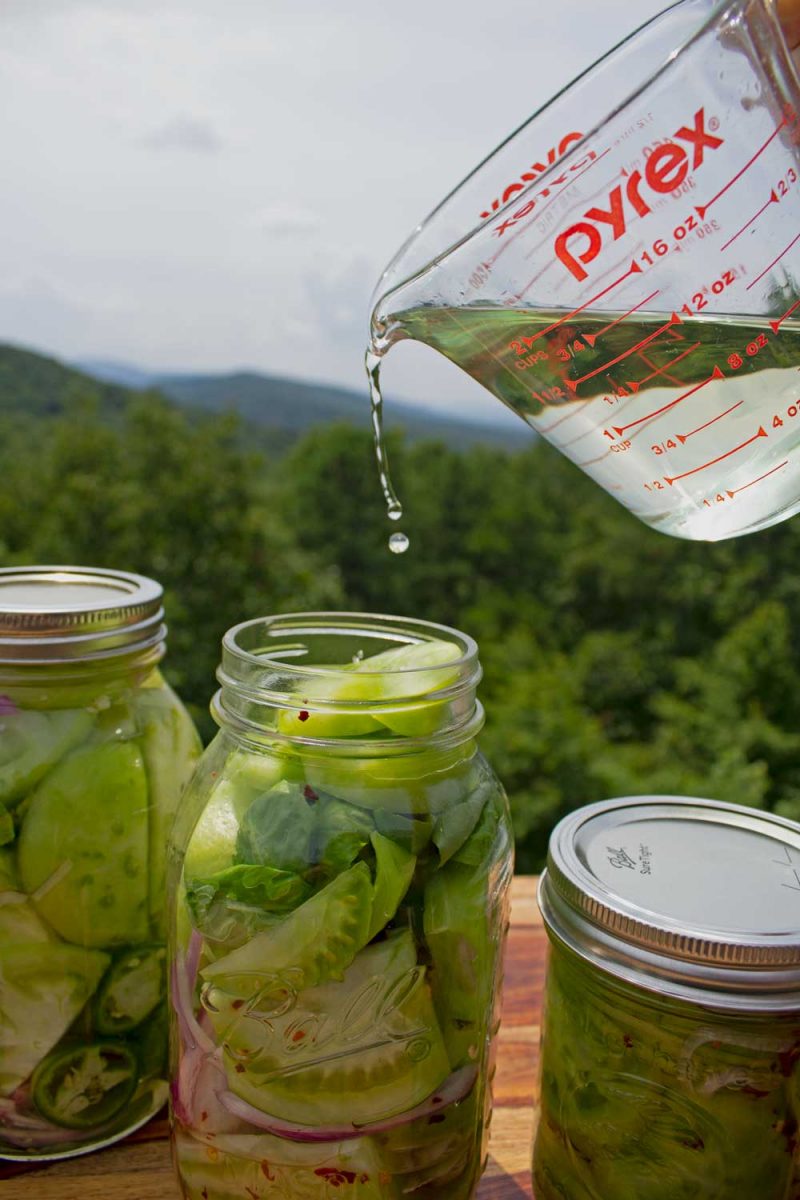 pouring brine into jar