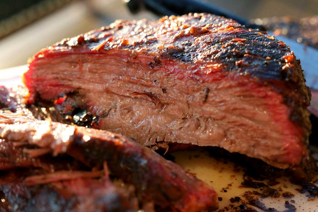 sliced chunk of smoke brisket