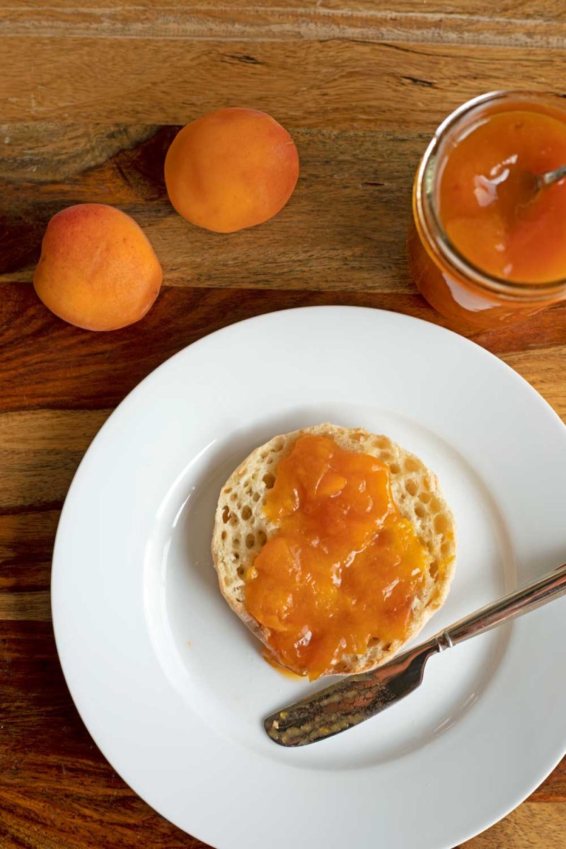 apricot jam spread on English muffin