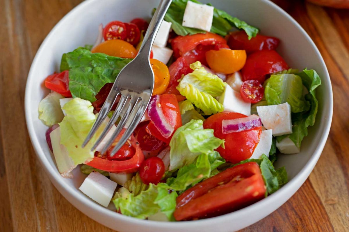 bowl of marinated tomato salad with fork