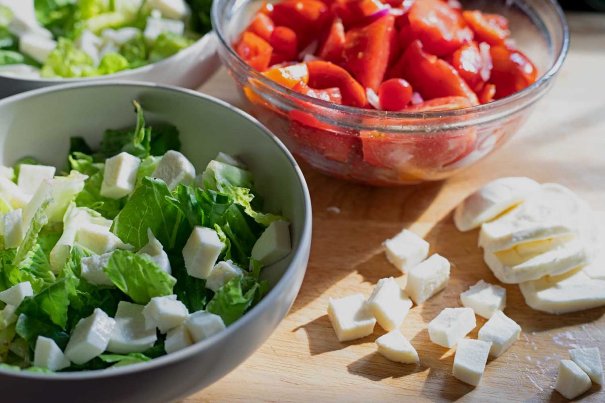 bowls of tomatoes mozzarella and lettuce