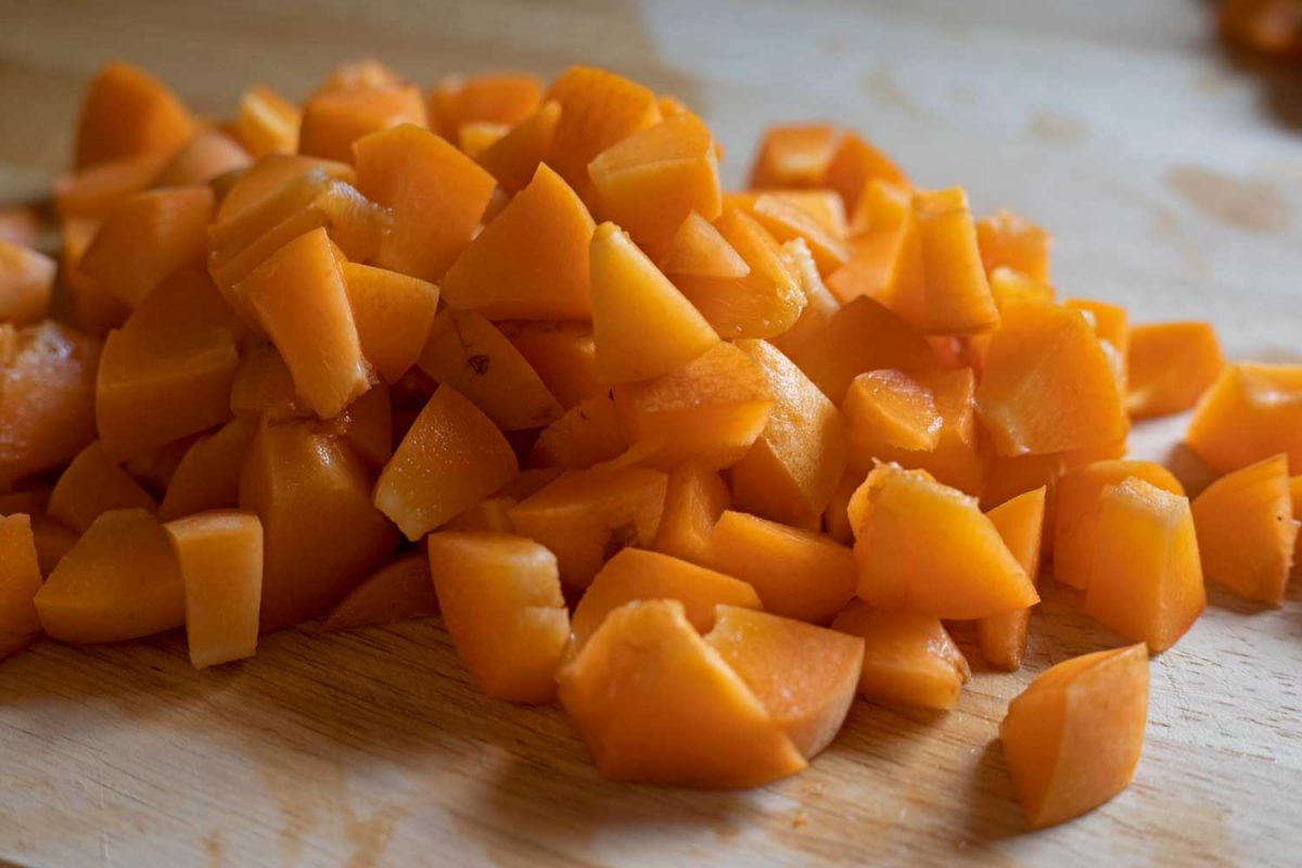 chopped apricots in pile on cutting board