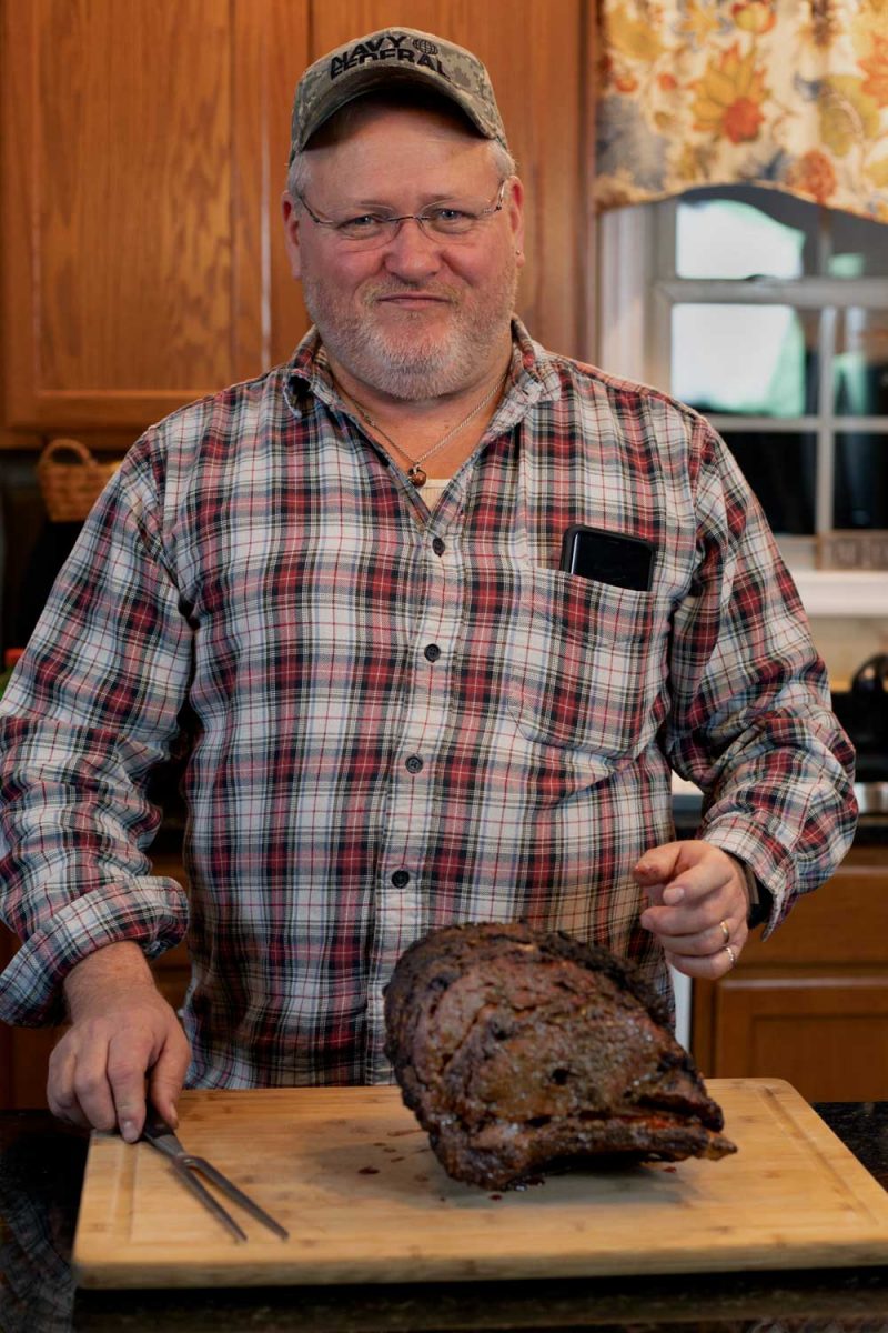 David please smile with his meat on carving board