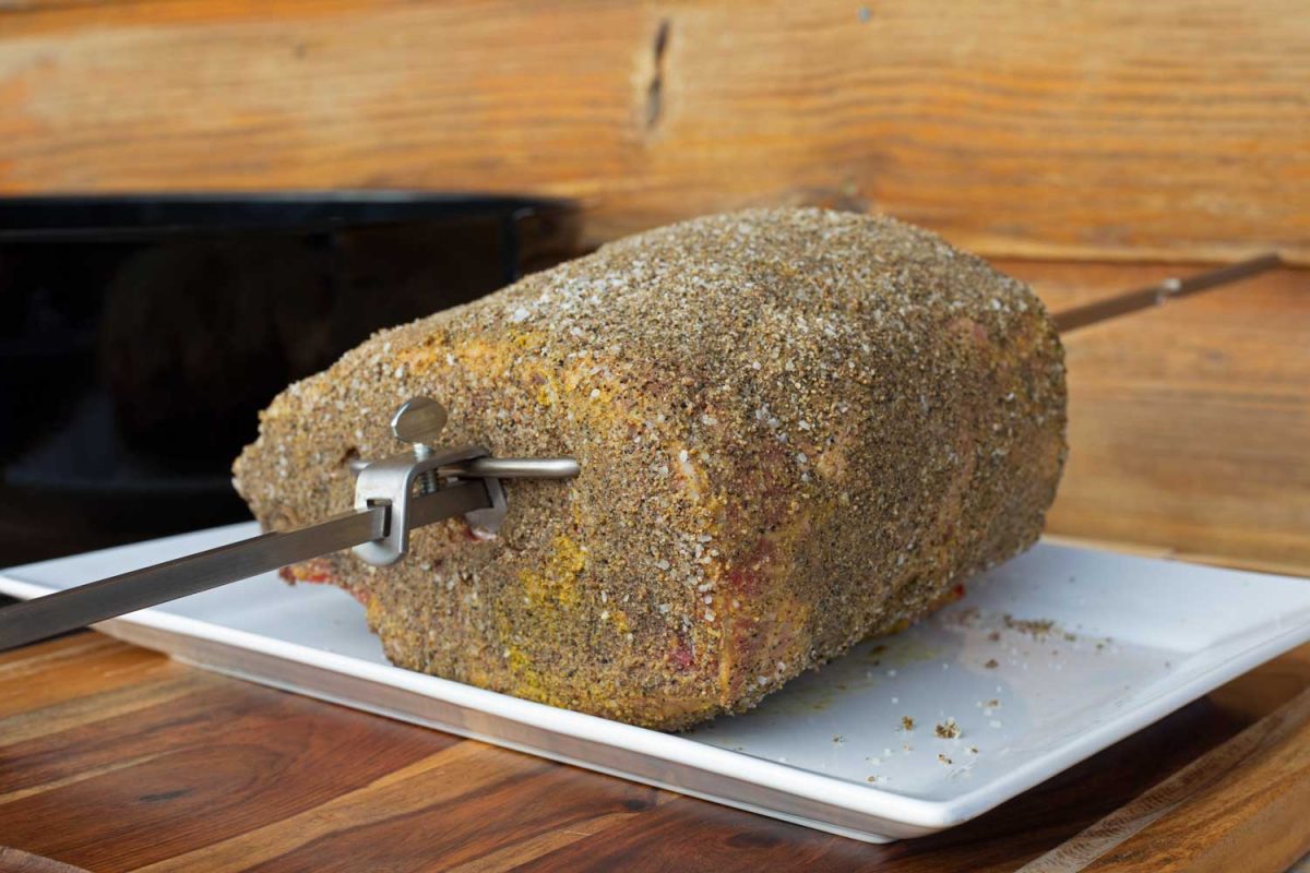 prime rib on spit coated with dry rub