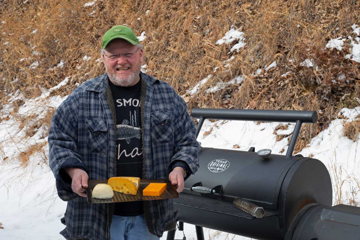 David in front of smoker with silly grin