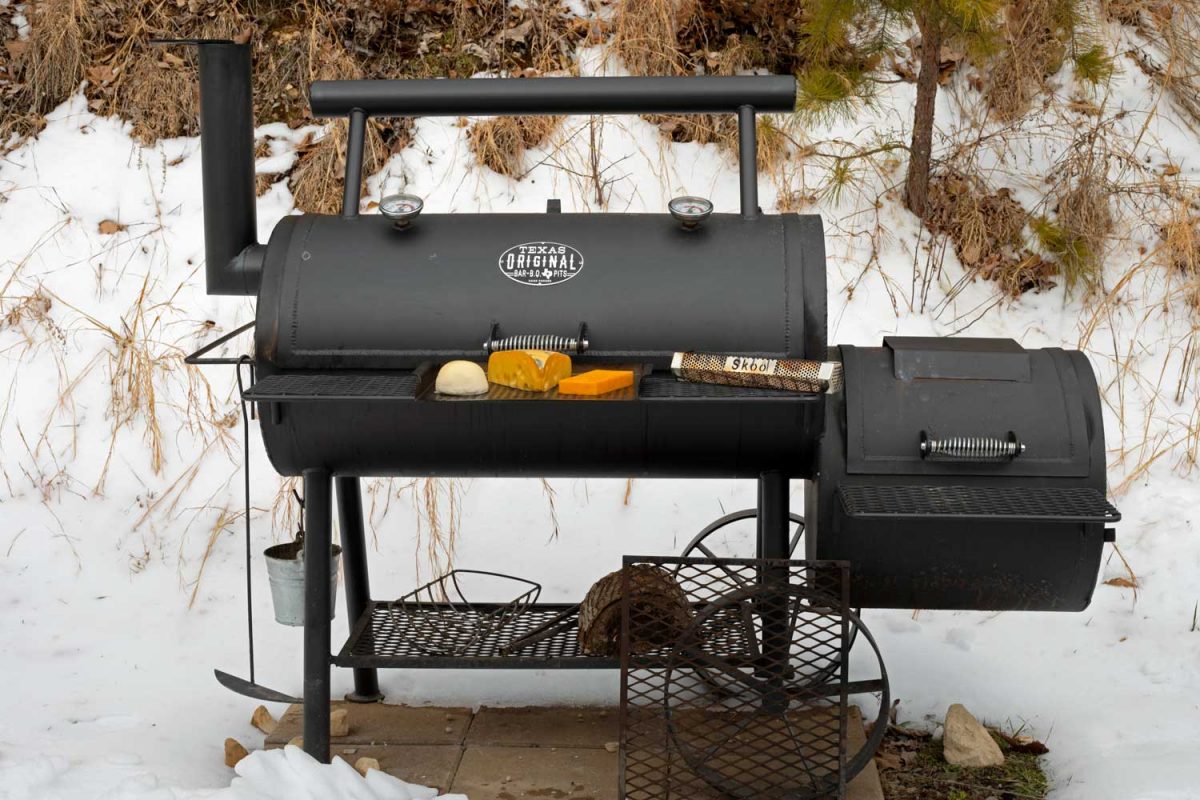 offset smoker with tools and ingredients