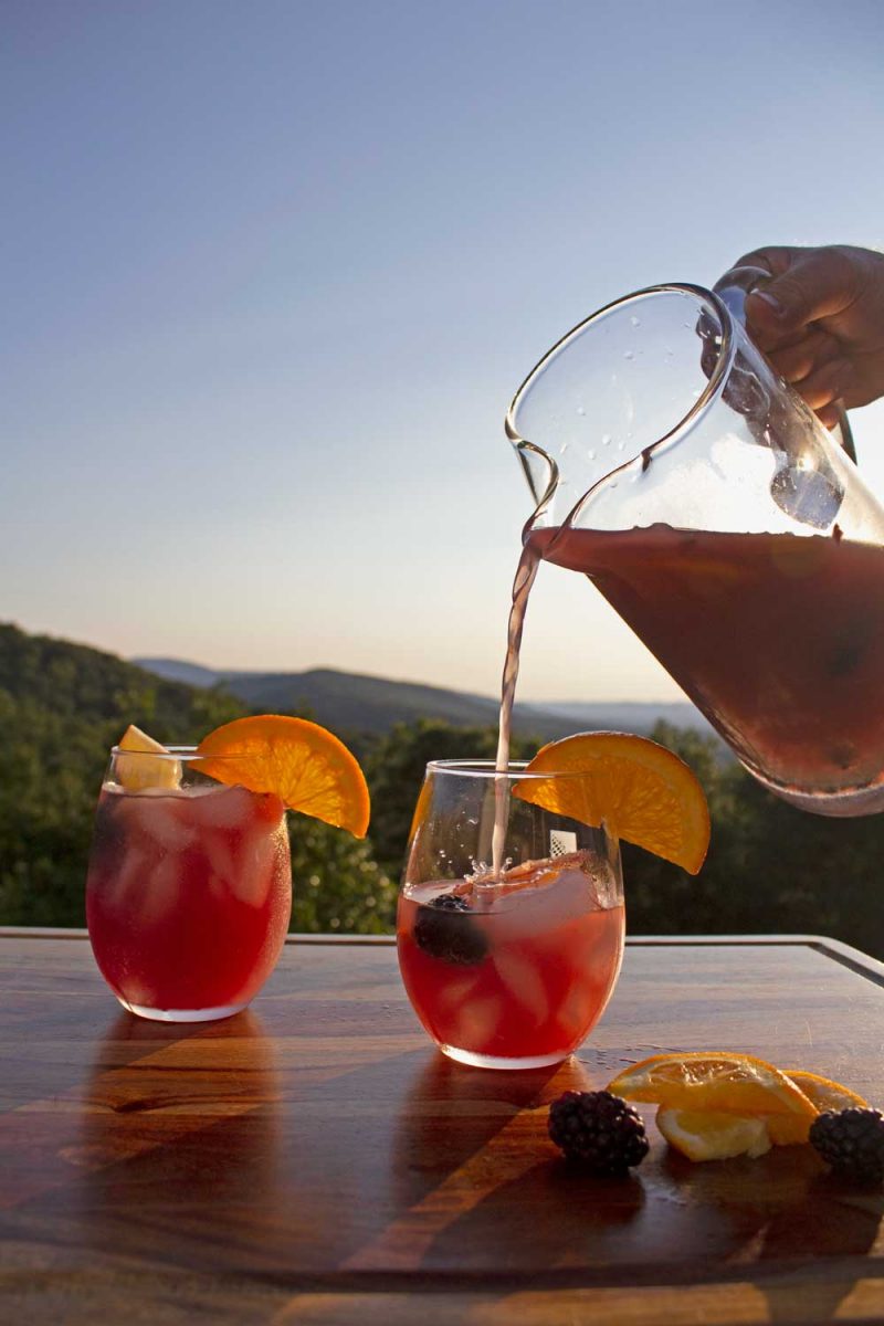 pitcher pouring sangria into glass
