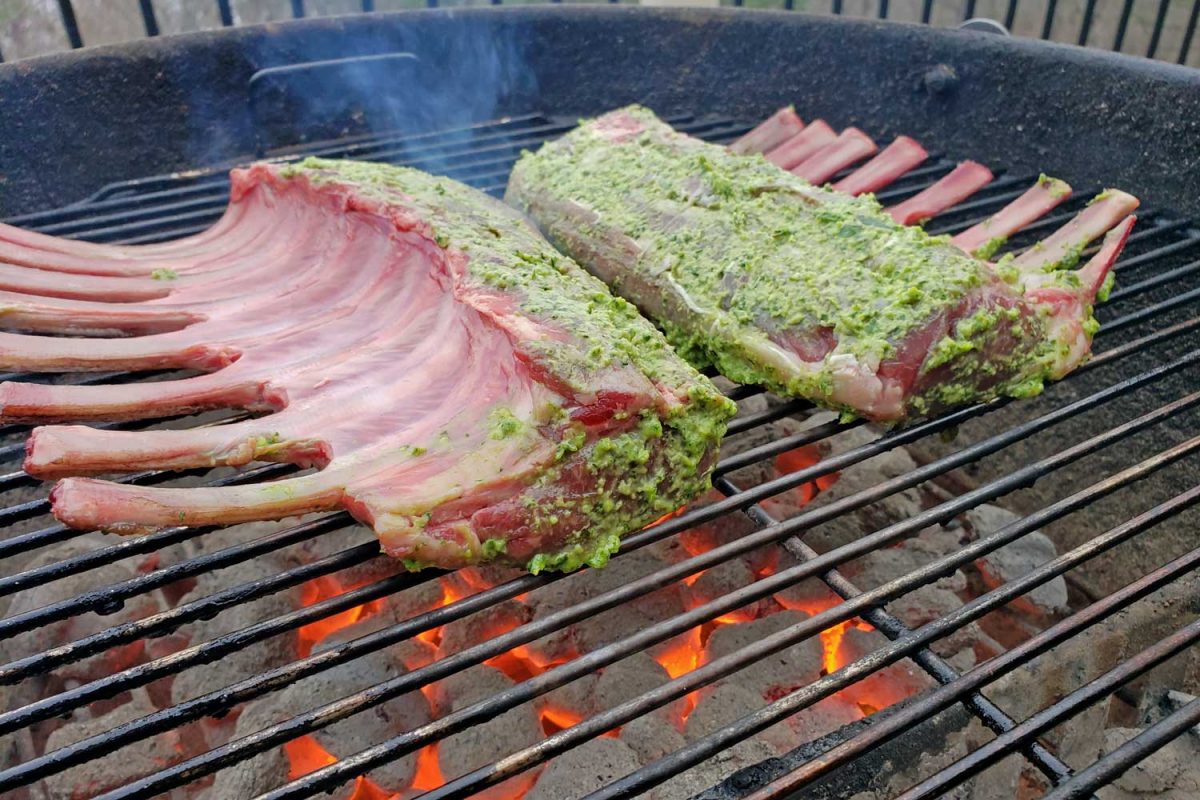 racks of lamb searing on grill