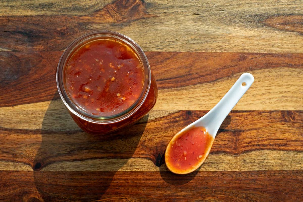 jar of Thai sweet chili sauce with spoon
