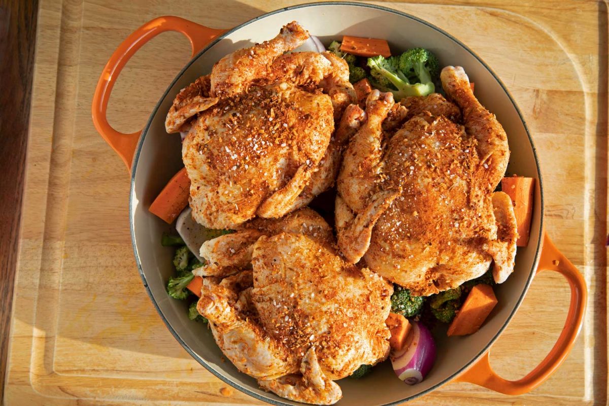 Cornish games hens with vegetables ready for the oven