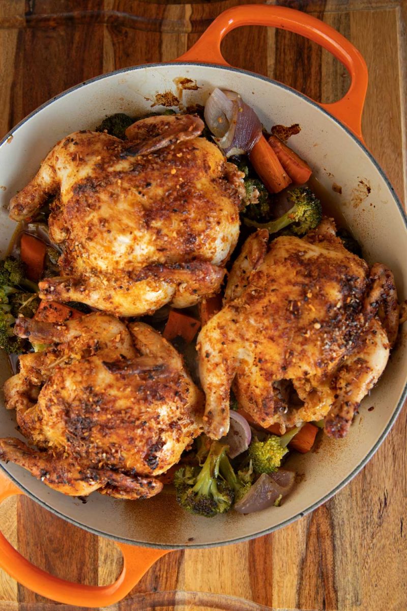 brazier with roasted Cornish game hens and vegetables