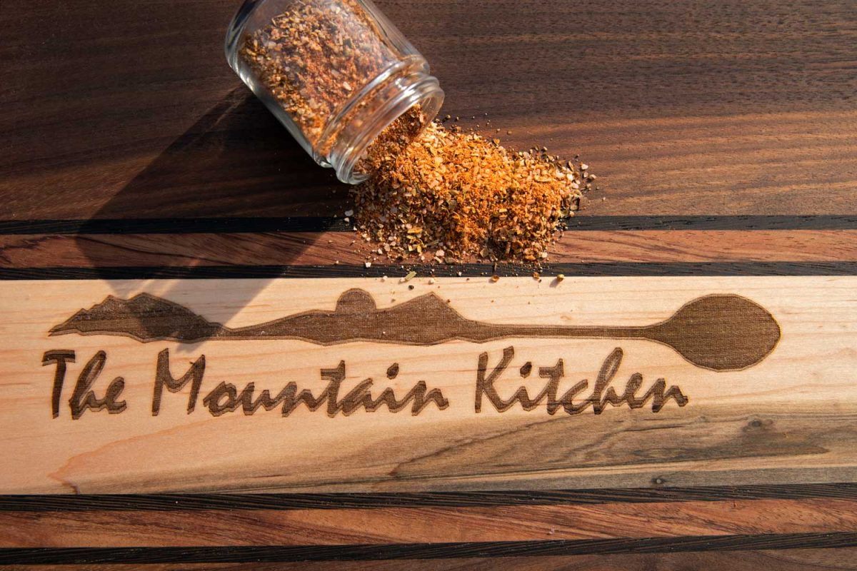cutting board with beef dry rub spilled out on it