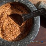 mortar of beef dry rub with spoon
