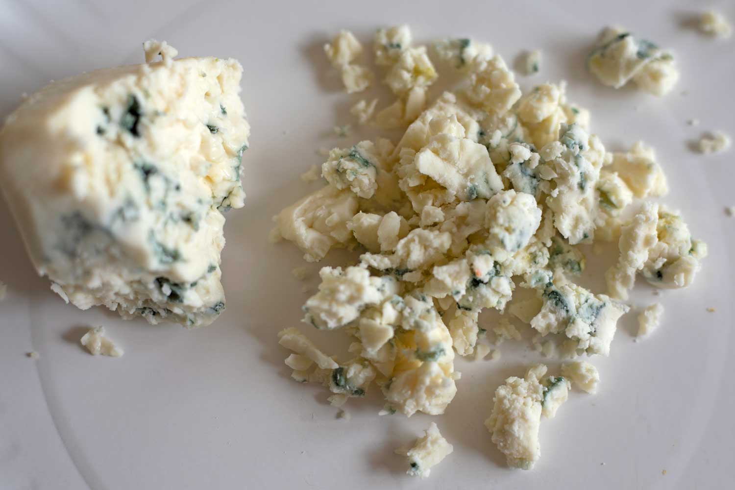 crumbled blue cheese on plate