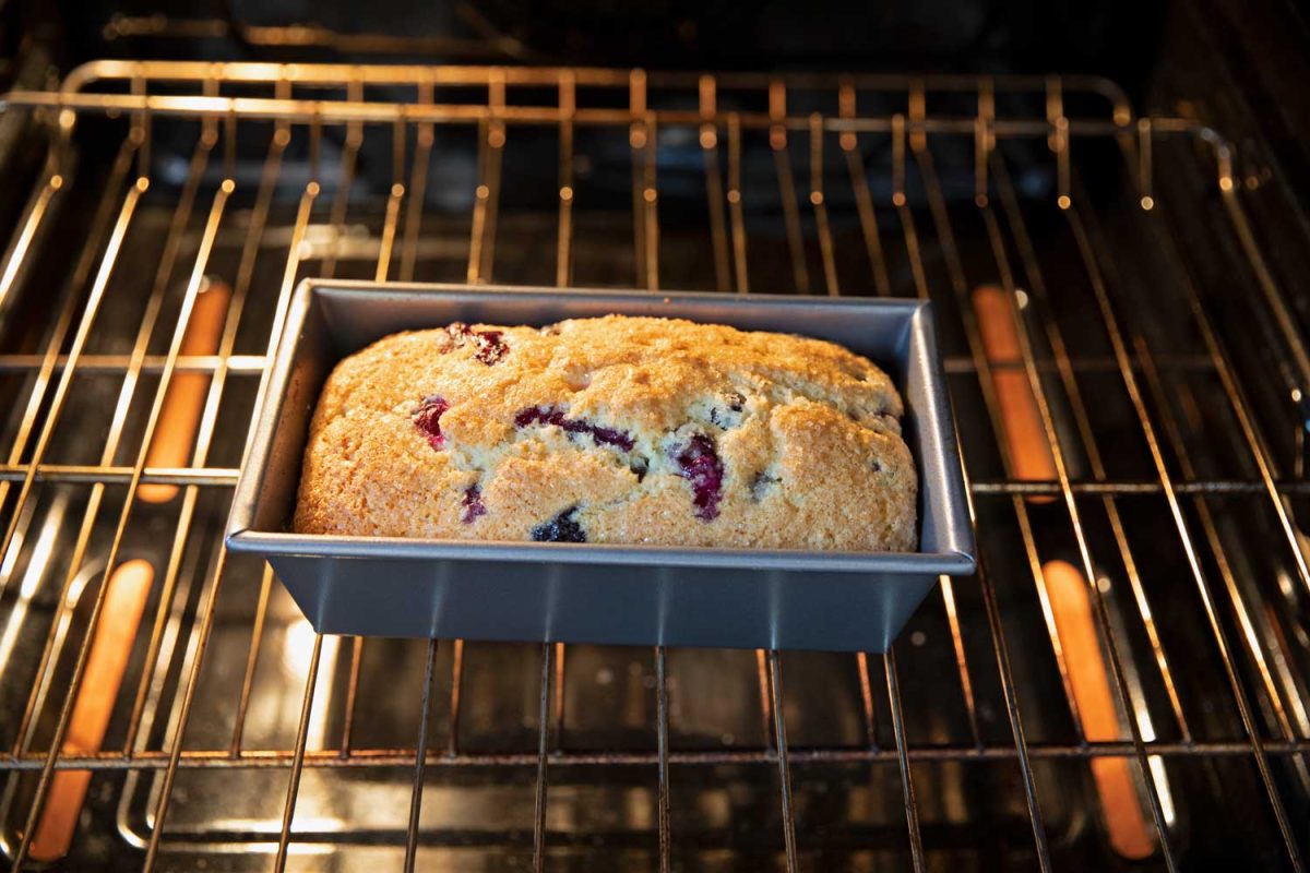 blueberry bread baking in oven