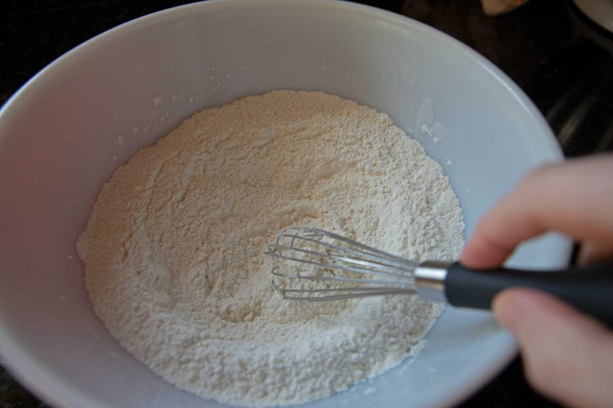 whisking flour with whisk