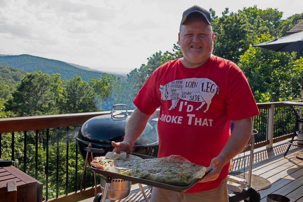 David holding ribs on sheet pan