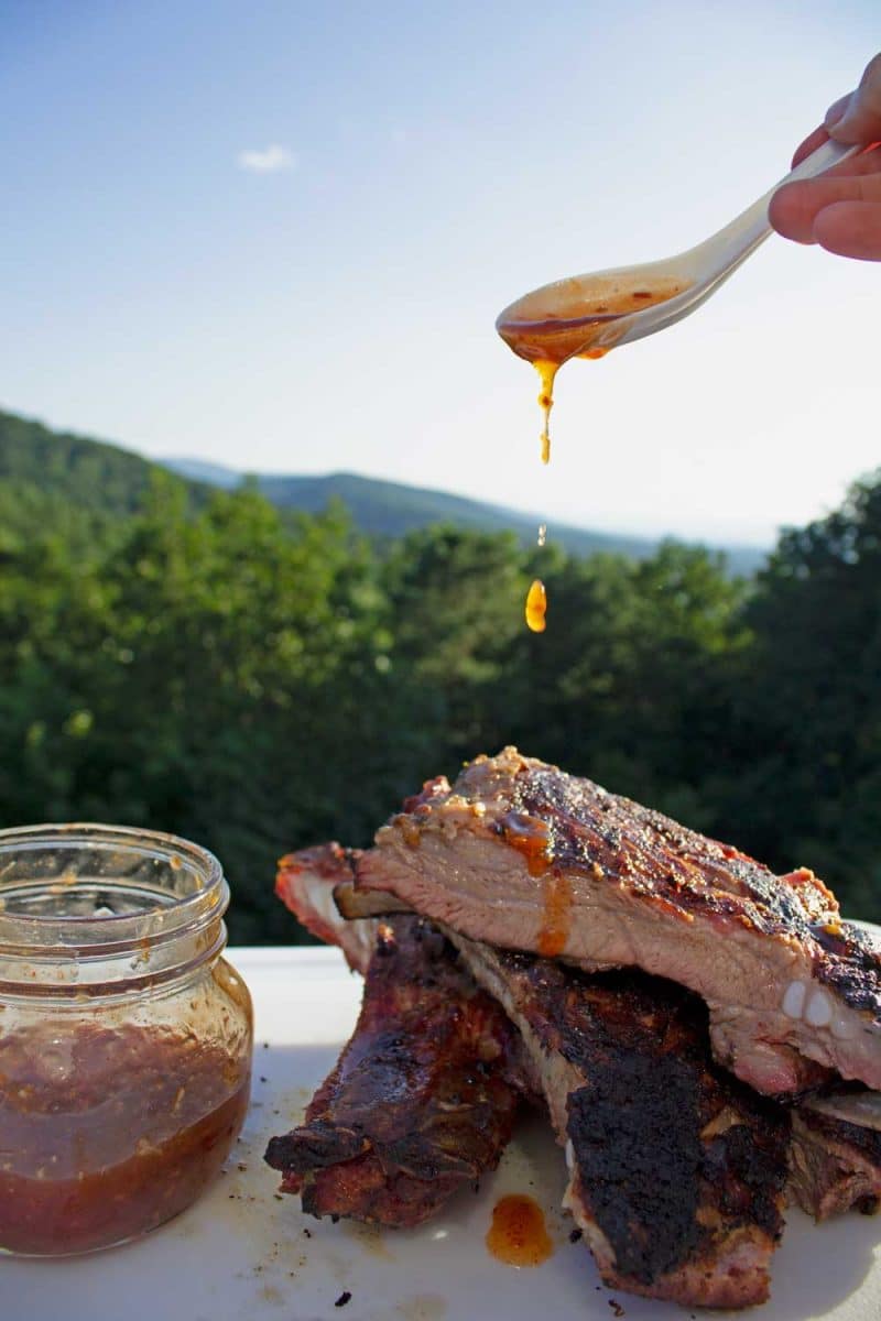 drizzling thai sweet chili sauce onto ribs