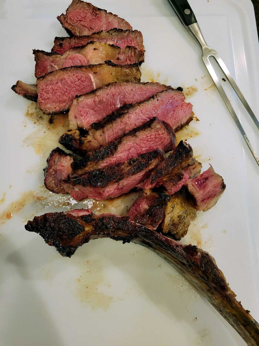sliced steak on cutting board