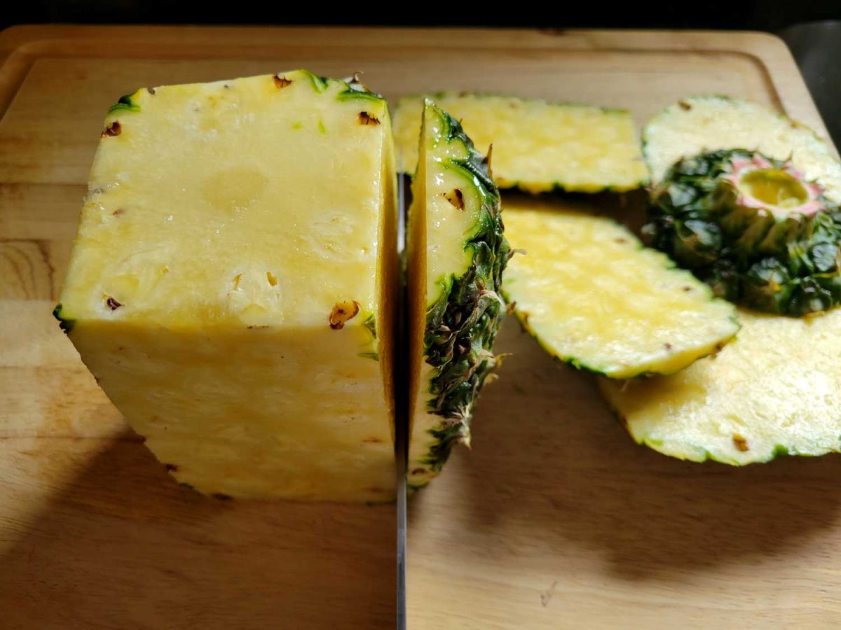 cutting pineapple into planks
