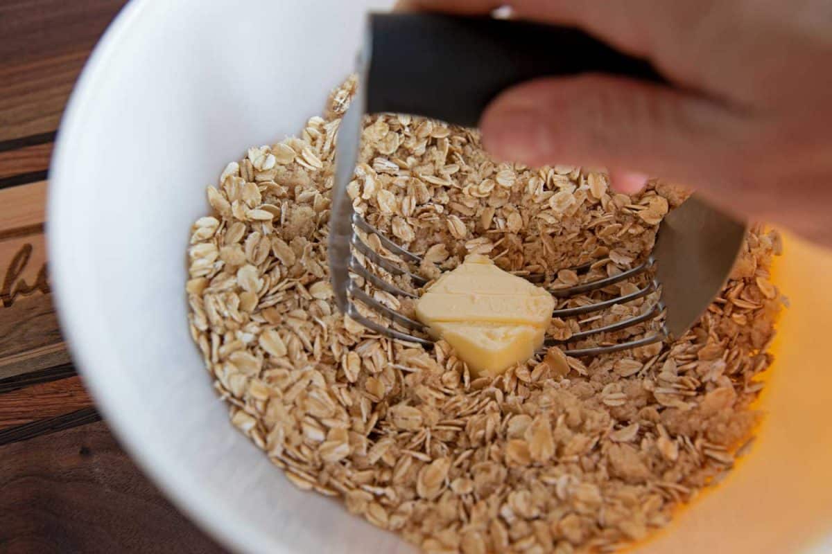 cutting butter into oats with dough cutter