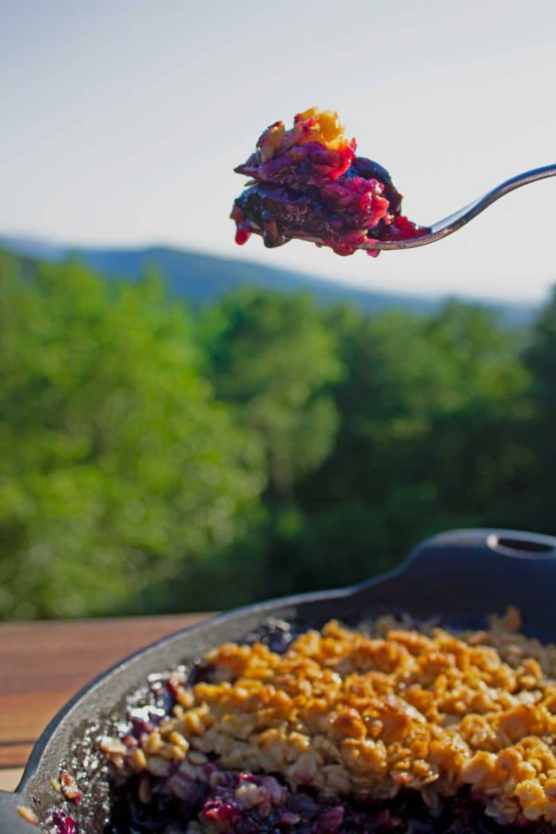 Bite of grilled cherry crisp on fork