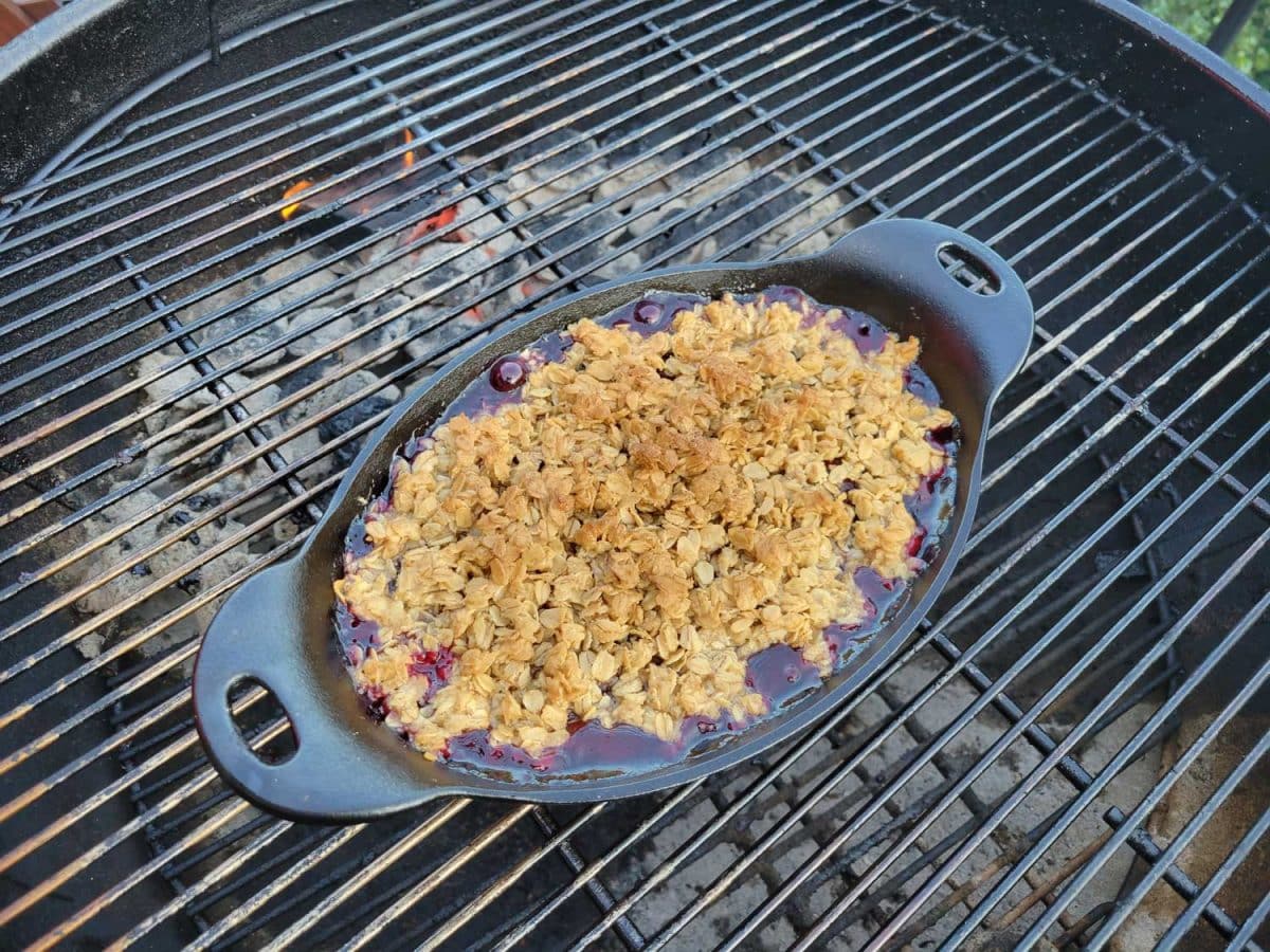 hot bubbling cherry crisp on grill