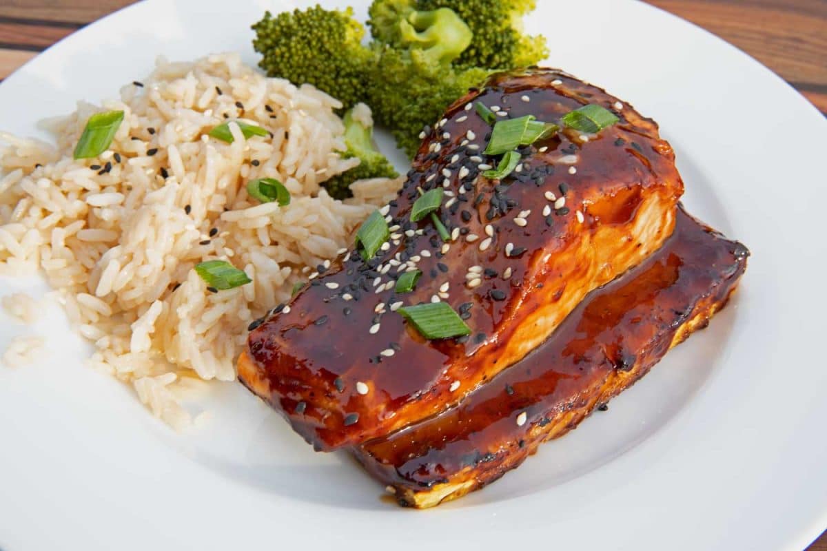 pineapple grilled salmon with rice and broccoli on plate