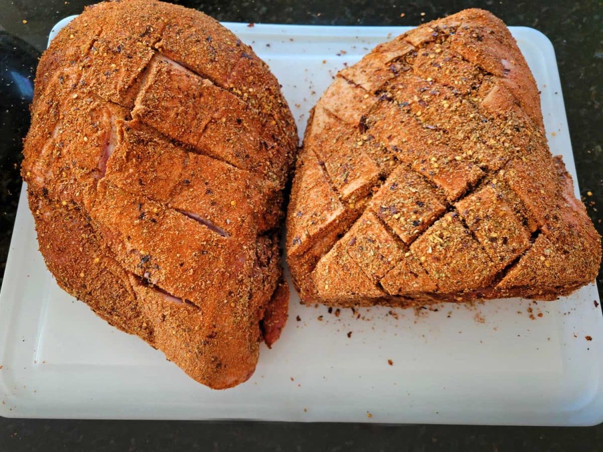 raw pork scored and rubbed with all-purpose pork rub