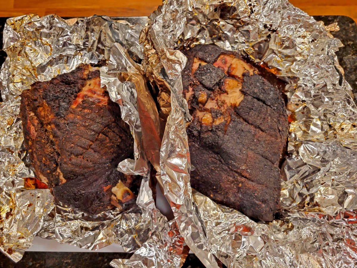 both cuts of pork in aluminum foil