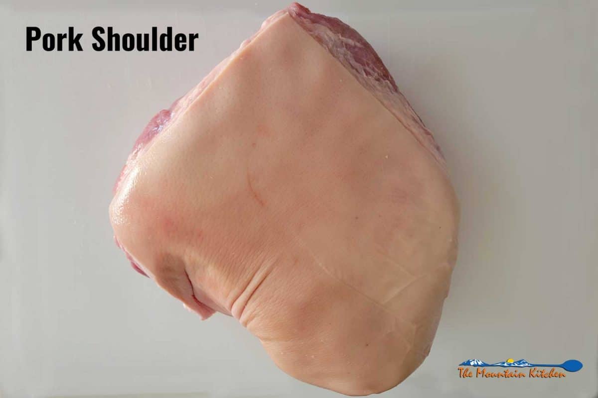 raw pork shoulder on cutting board