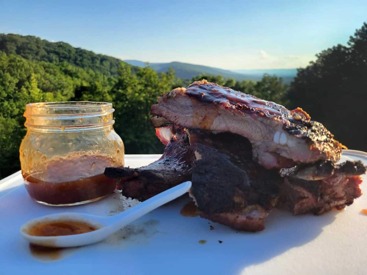 Thai sweet Chili Ribs stacked on cutting board with chili sauce